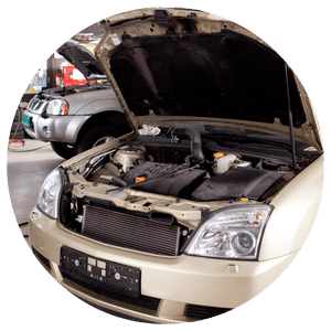 car with hood open in auto repair shop