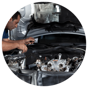 technician working on car under the hood